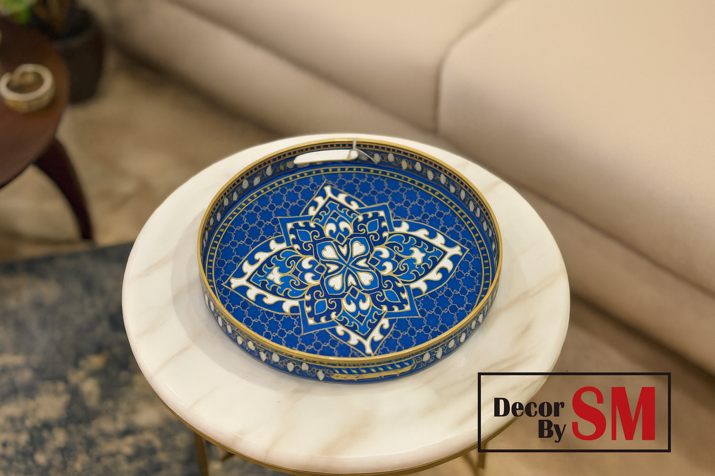 Blue and gold decorative tray on modern center table in living room