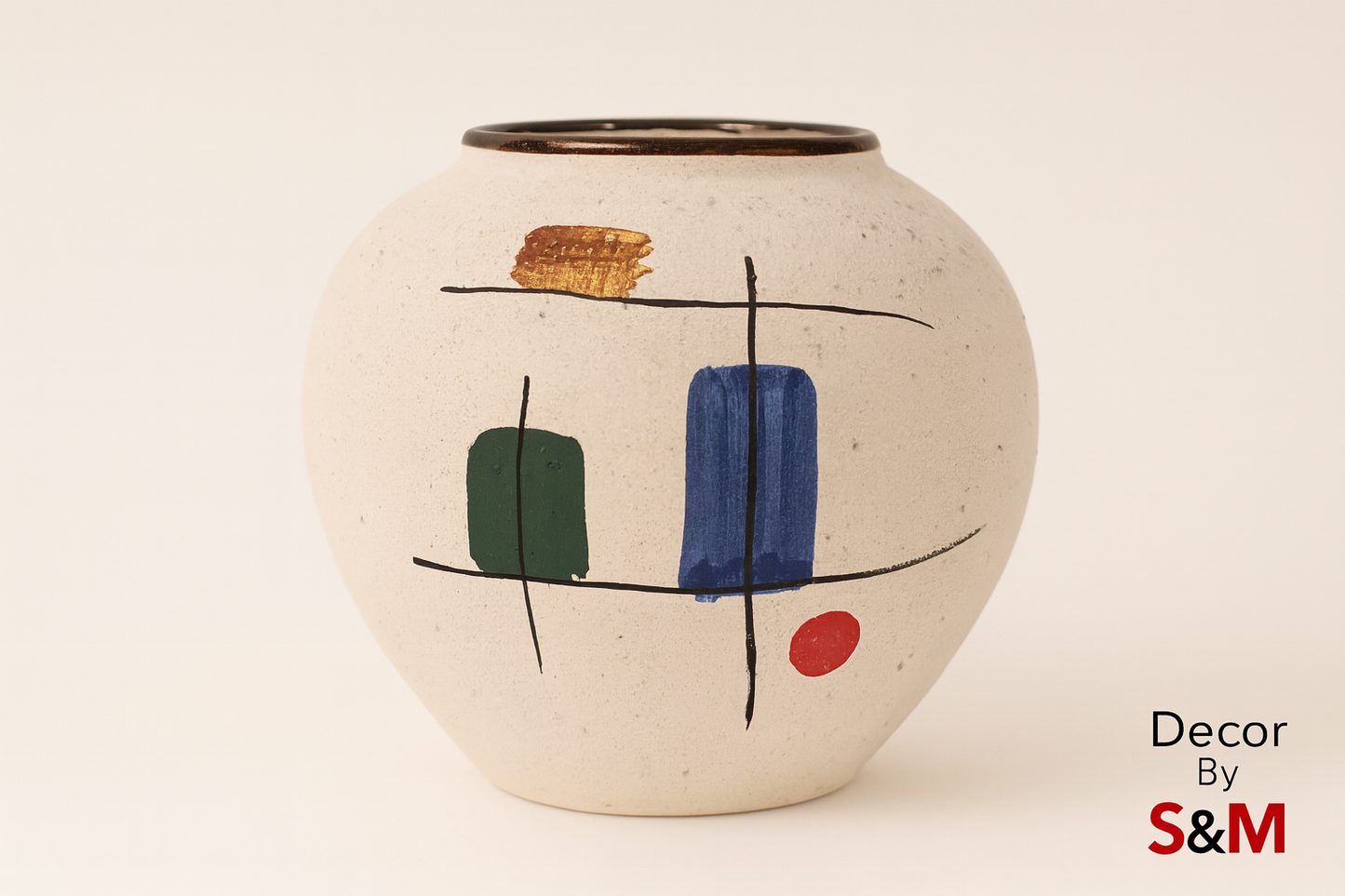 Ceramic vase with colorful geometric patterns on warm white background