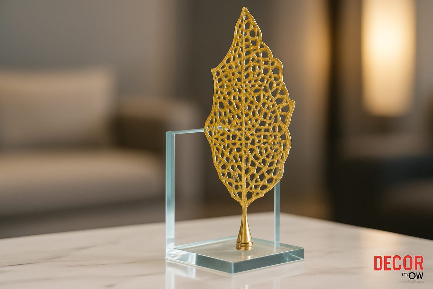 Golden leaf sculpture with filigree patterns on crystal base on modern side table