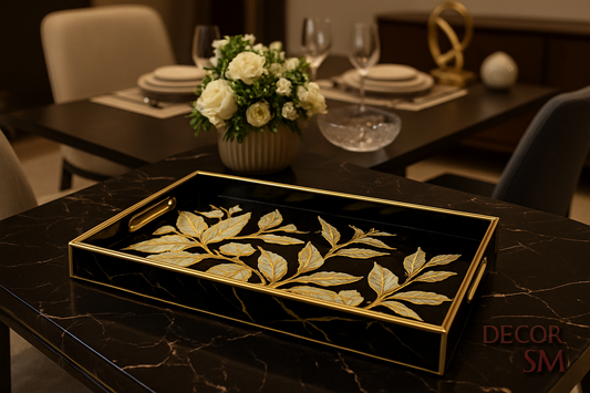 Black and gold leaf pattern serving tray on table