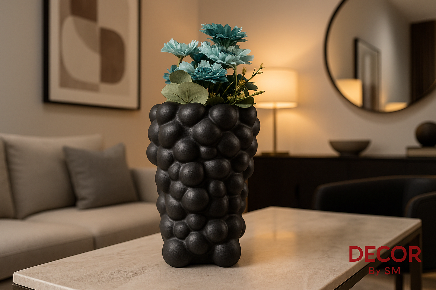 Black bubble-textured vase with blue flowers in sophisticated setting