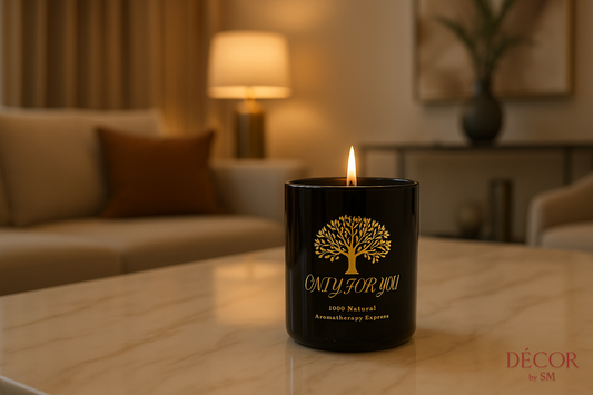 Black glass candle with golden tree design in elegant setting