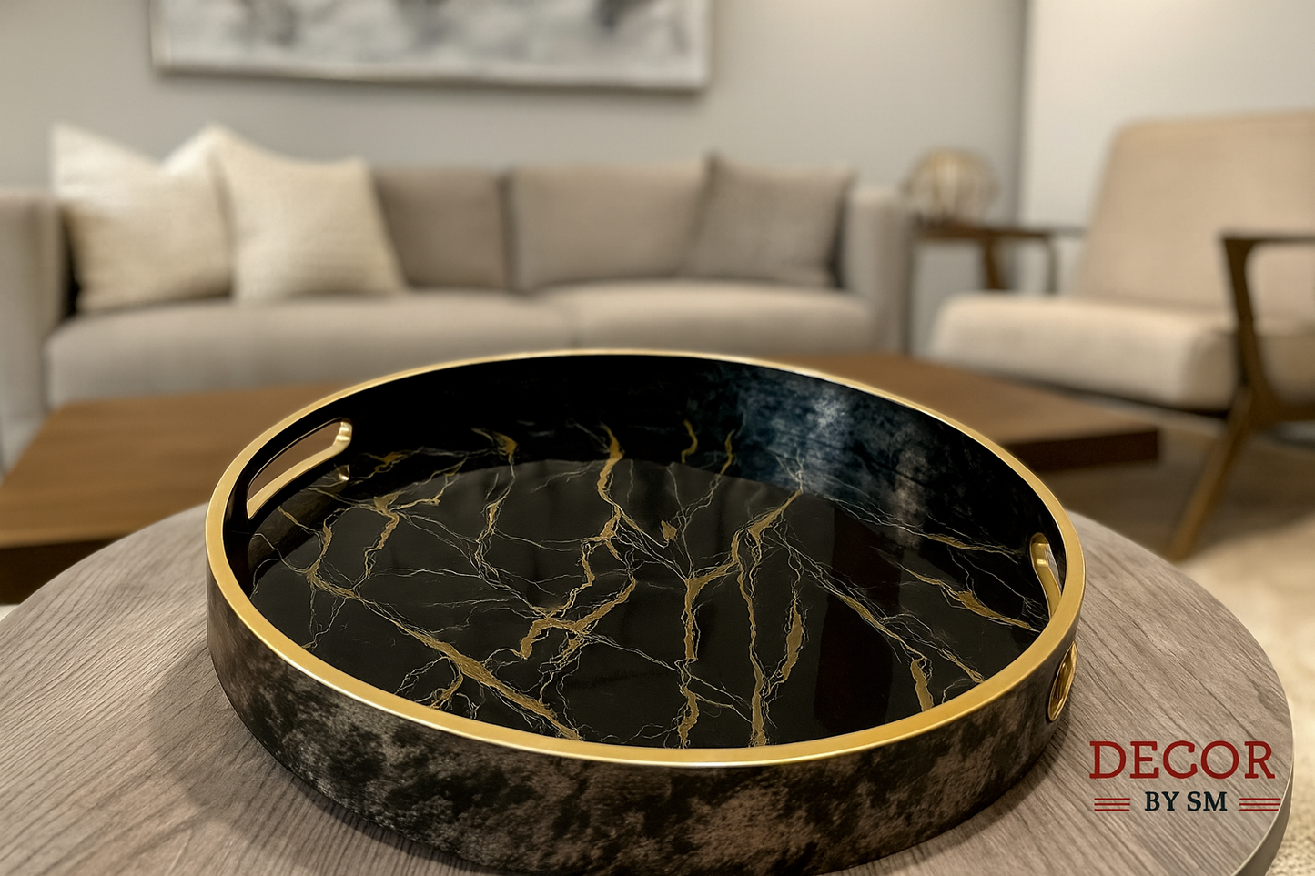 Black marble-effect serving tray with golden veining on modern center table