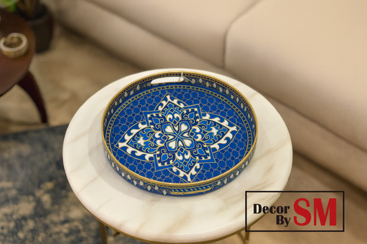 Blue and gold decorative tray on modern center table in living room