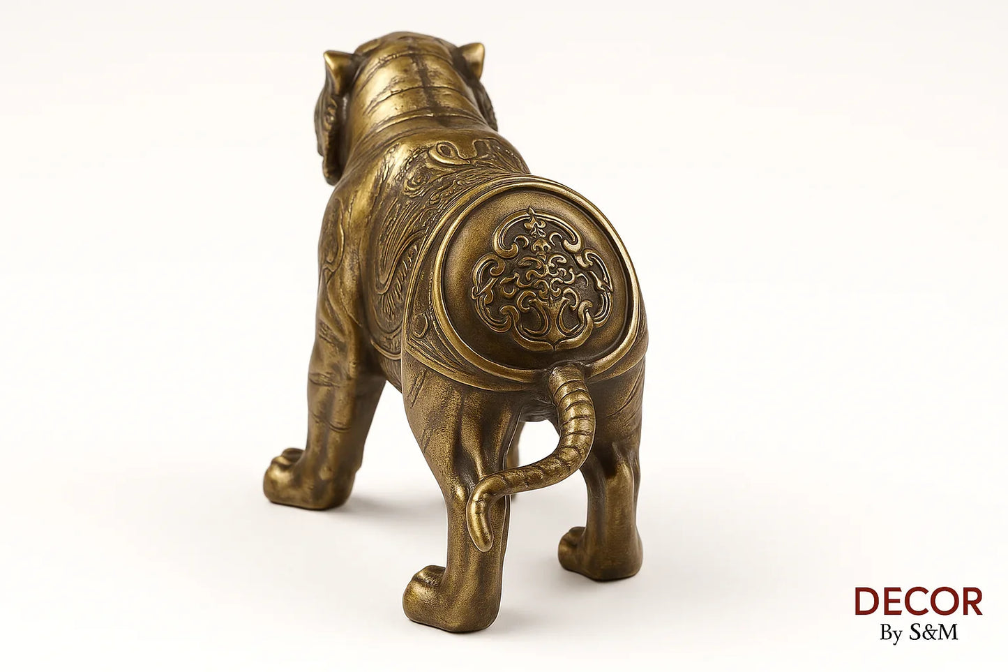 Bronze tiger figurine back view with medallion on white background