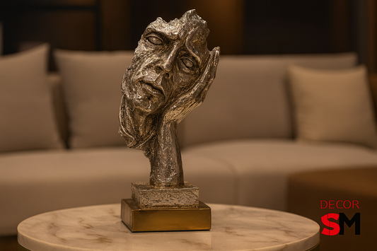 Dramatic thinking figure sculpture on marble-top side table