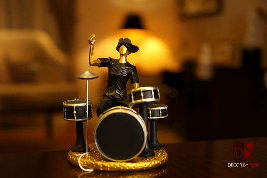 Drummer figurine on dark wood console in luxurious living room