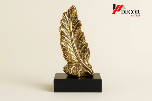 Gold feather sculpture with watermark