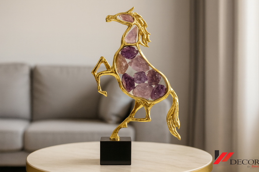 Golden horse sculpture with amethyst crystals on table in minimal interior