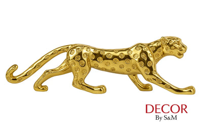 Golden leopard figurine side view on white background