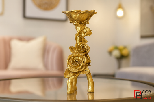Golden rose candlestick holder on glass table in contemporary living space