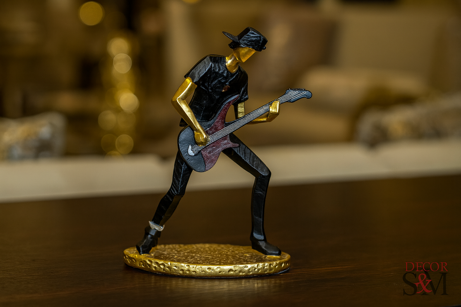 Rock guitarist figurine on dark wood console in luxurious living room